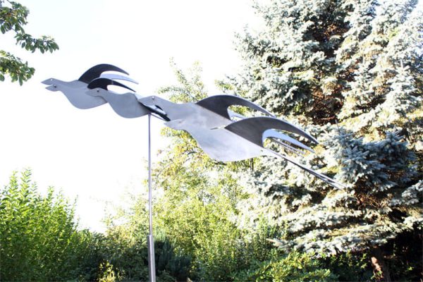 stainless steel sculpture of a flight-birds