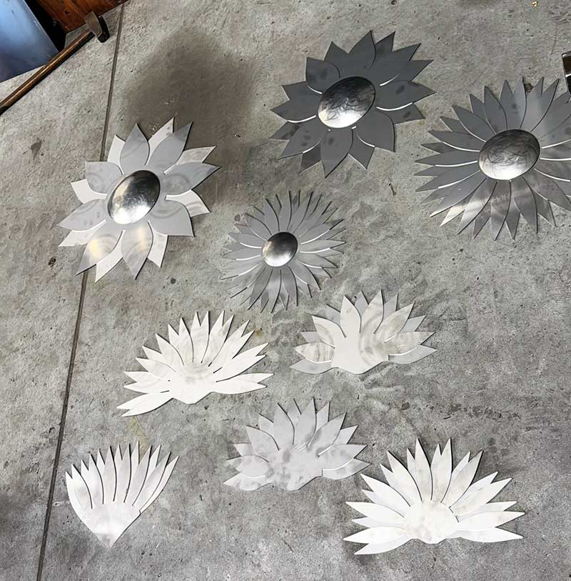 cut stainless steel parts for the sunflowers before shaping and assembly